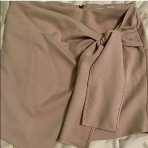 Fitted light blush colored skirt. Flattering